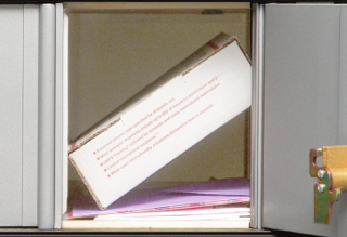 Image of the Small PO Box, Size 2, with a small package and mail inside.